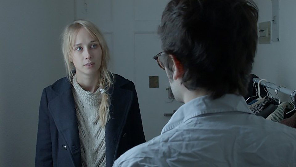 Movie still: Hugo talking to his flatmate Mireia